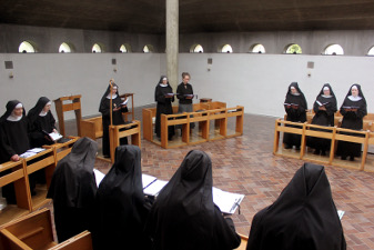 Nuns singing the office in church